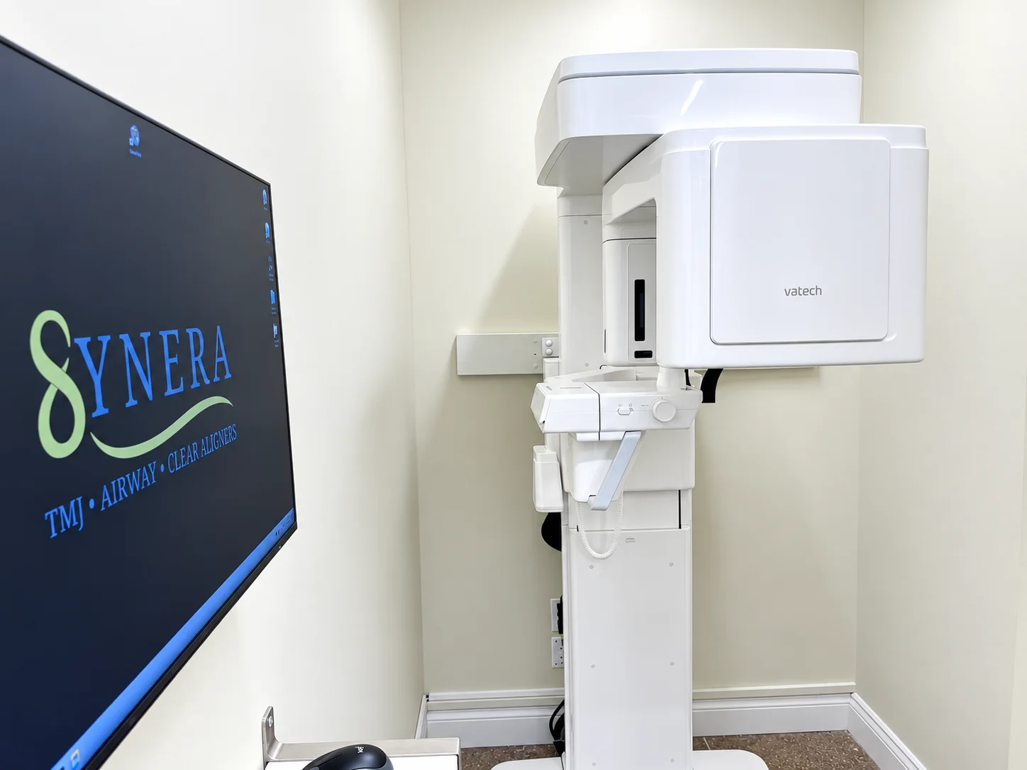 Cone beam CT imaging unit beside the Synera display